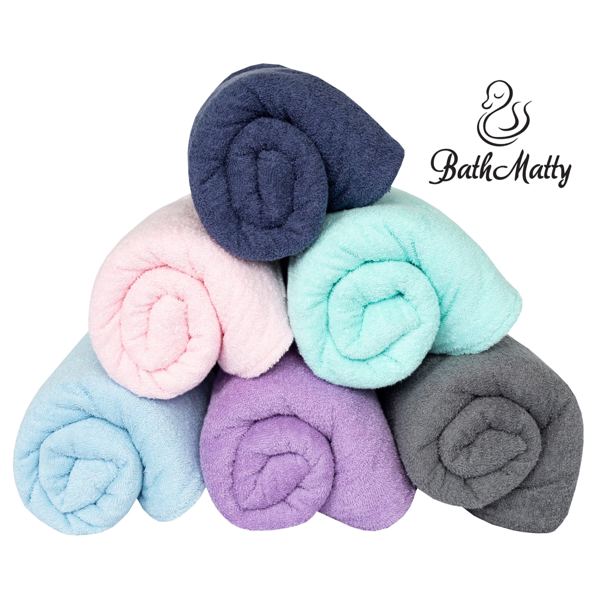 Six BathMatty mats rolled and stacked in navy, blush, mint, sky, lavender and slate
